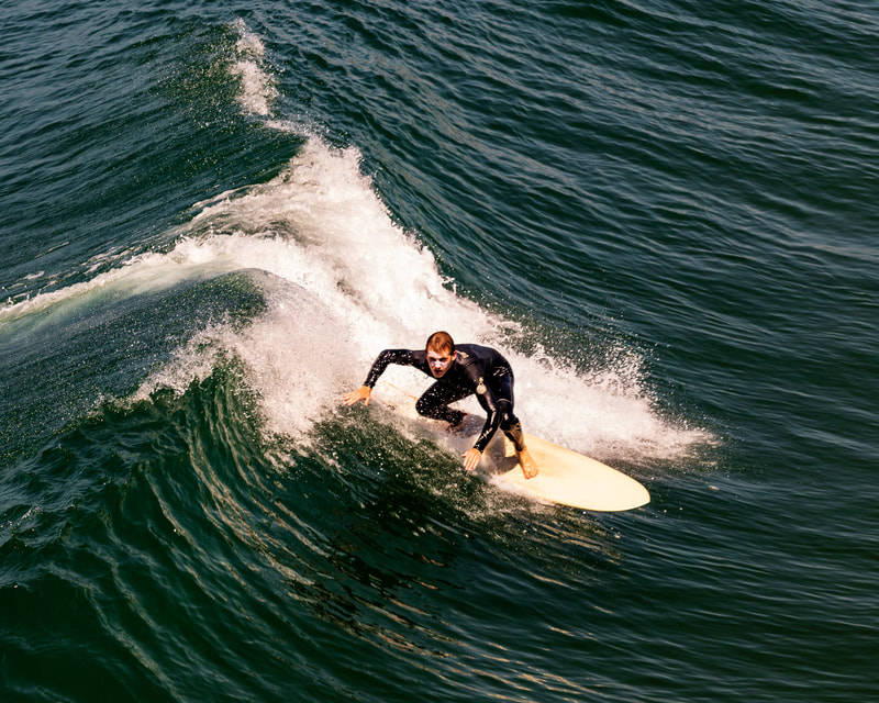 A surfer in the trough of the wave.
